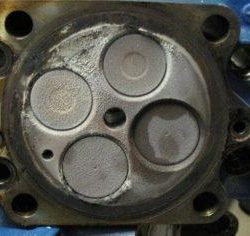 Photograph depicting deposits on engine parts using competitor product