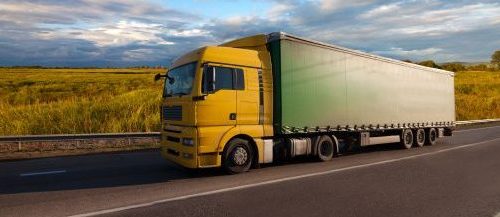 Truck riding on countryside road