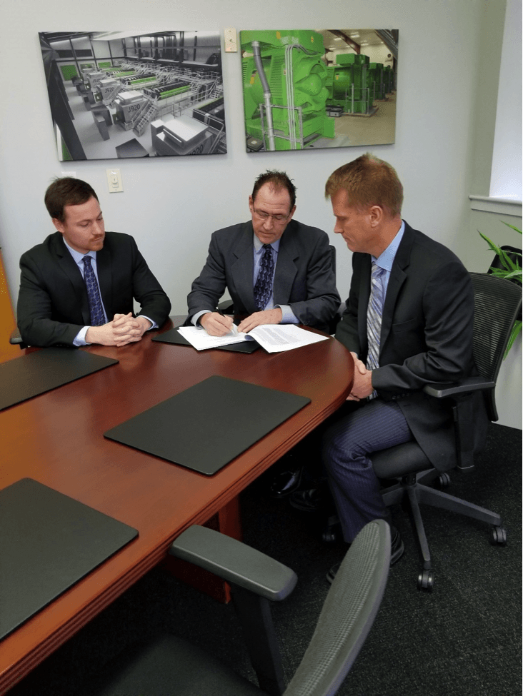 Signing partnership between Q8Oils & NES-WES